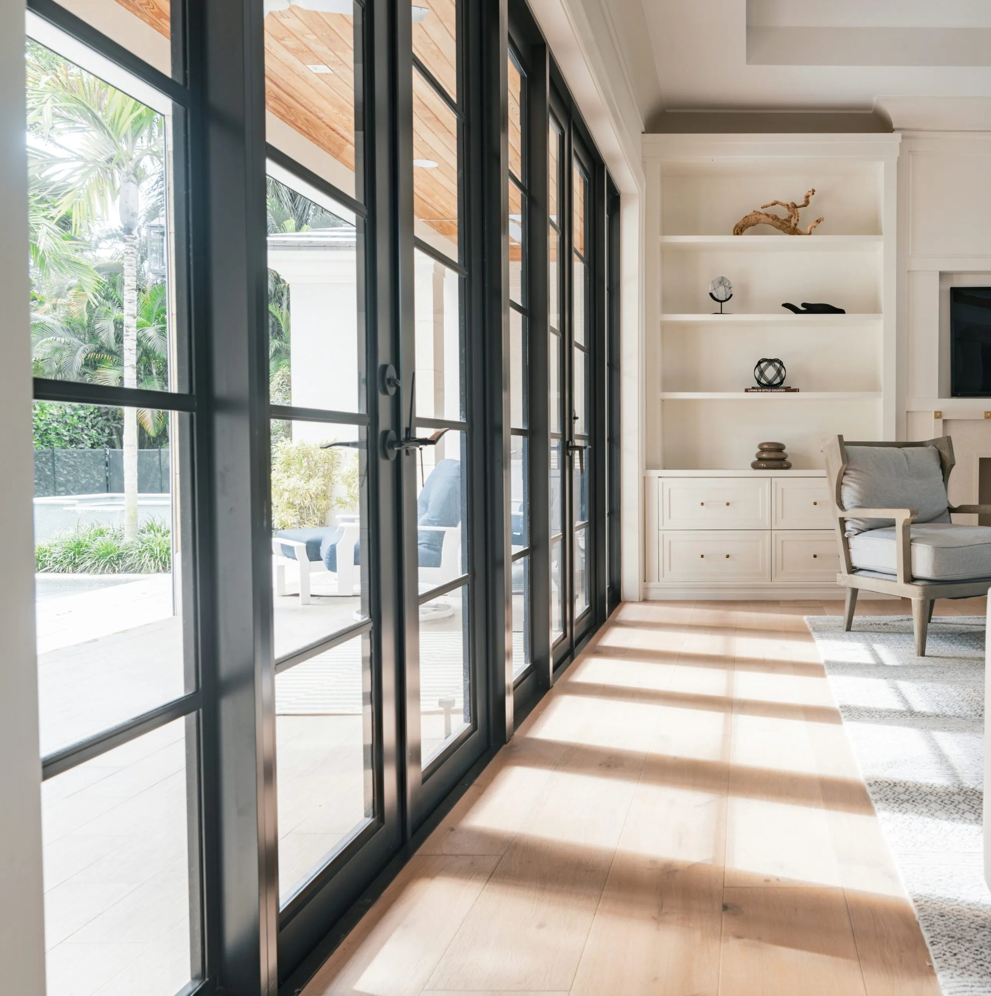 Interior of a Jacksonville home with black-framed glass patio doors installed by Duval Glass & Mirror